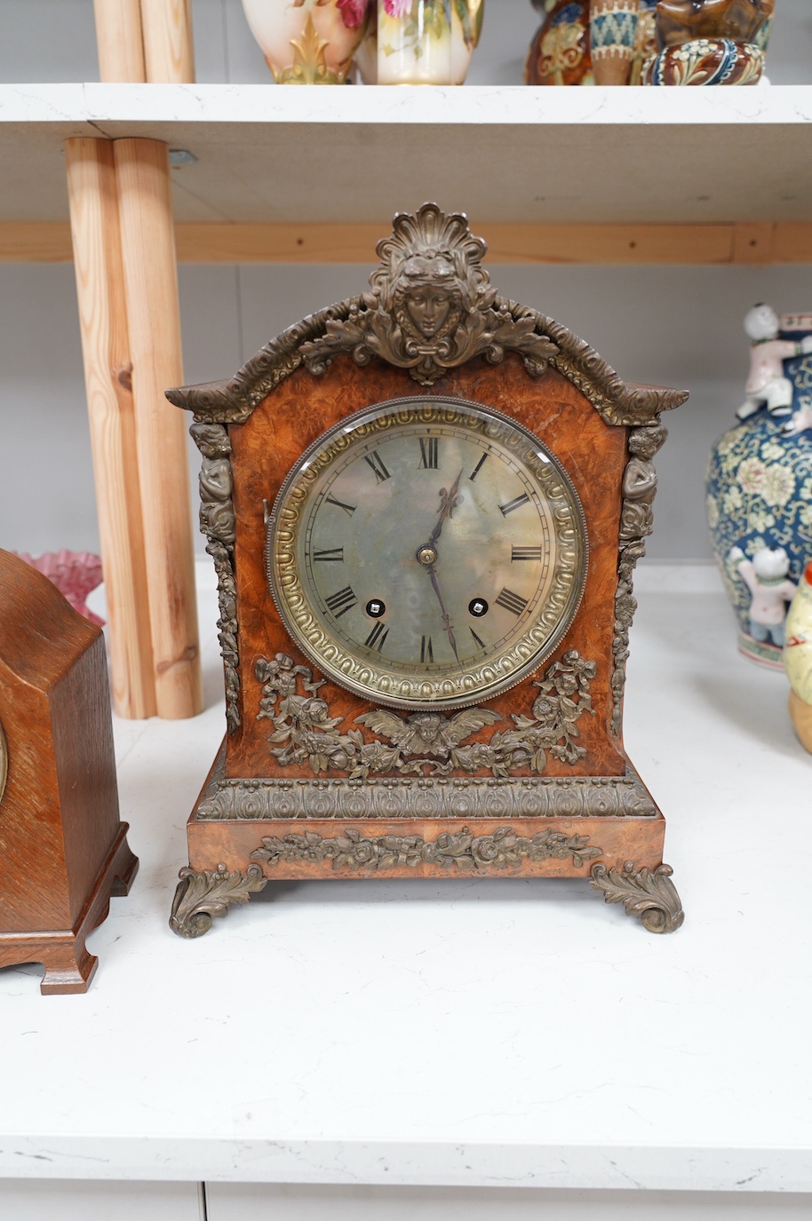 A late 19th century brass mounted burr walnut bracket clock with key and pendulum, and an oak mantel clock, tallest 37cm. Condition - poor to fair